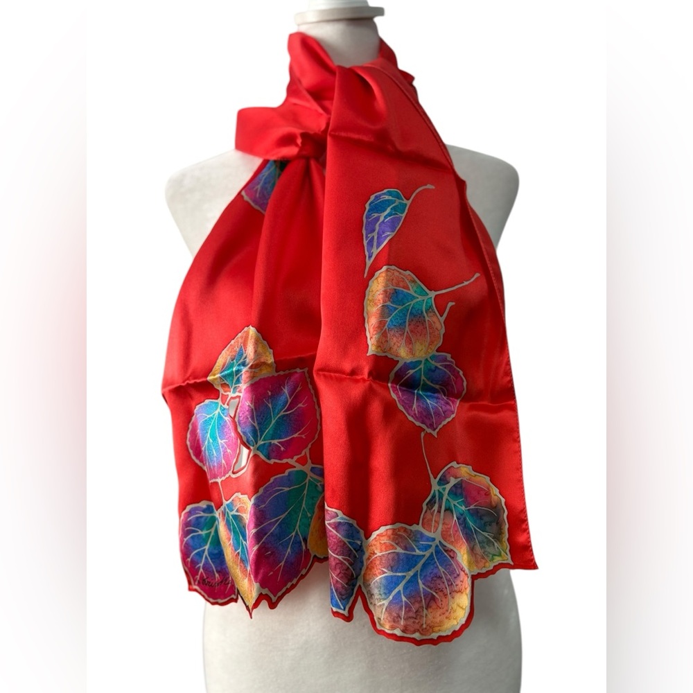 Kriska hand painted silk scarf. Red with multicolored leaves and cutouts. NWOT